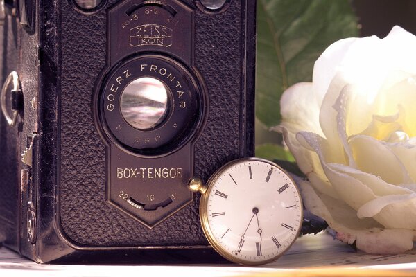 Photo of retro camera and pocket watch