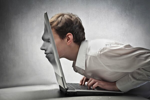 Creative photo of a man s face in a laptop