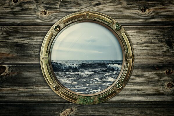 Image with a porthole with a view of the sea and waves