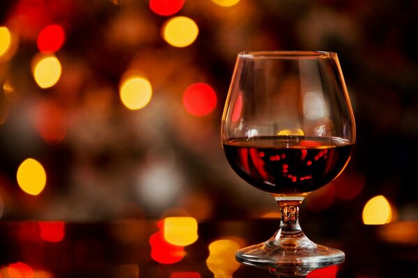 Cognac in a glass glass on a beautiful background