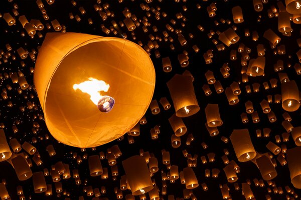 Lots of sky lanterns on a dark background