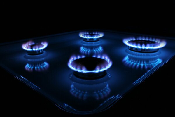 Four gas burners in the dark