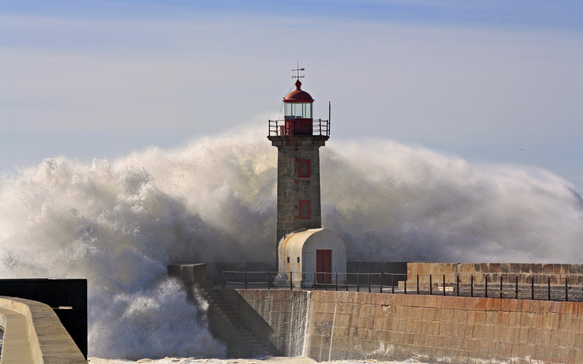 lighthouse wave spray sky