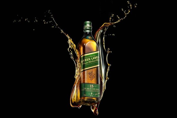 Johnny Walker whiskey by green label on a black background