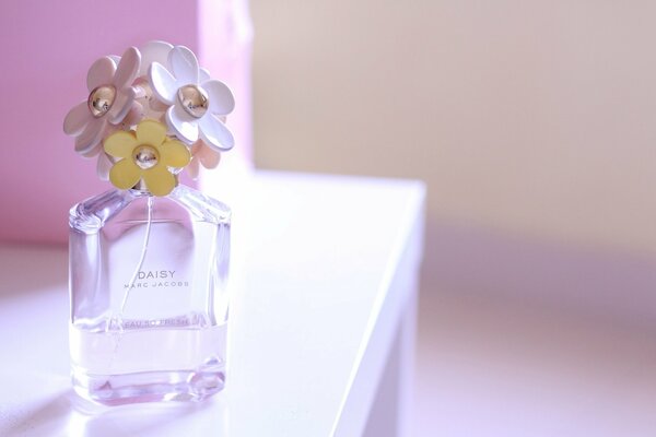 Perfume bottle with daisies in lavender color