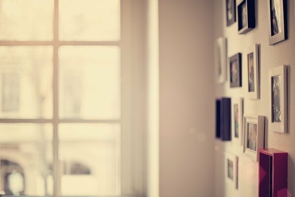 Paintings on the wall on the background of the window