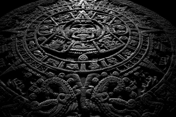 Image of the Mayan calendar on a stone