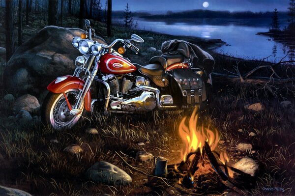 Immagine notturna di una moto accanto a un falò sulla riva del fiume