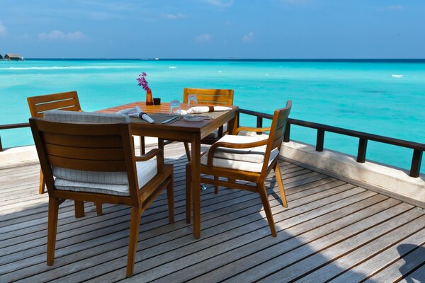 A meeting table on the shore of the Maldives