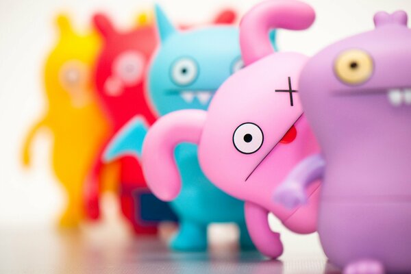 Colorful toys stand behind each other