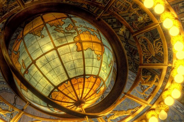 A huge glowing globe on the ceiling