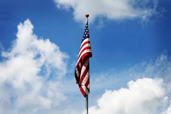 The flag of America over the sky awakens patriotism