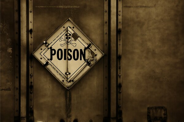 The sign caution poison on the box