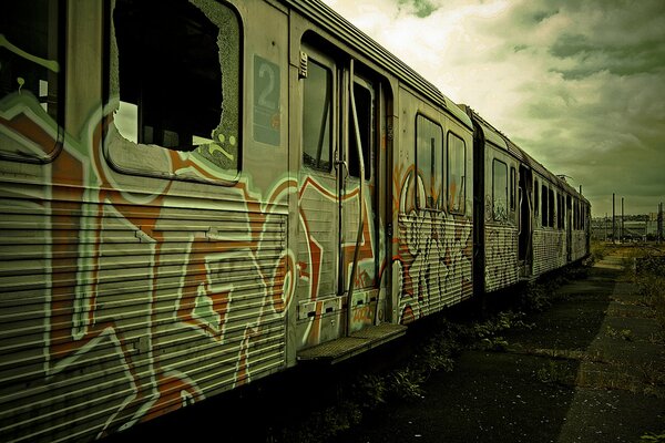 An abandoned train painted with graffiti