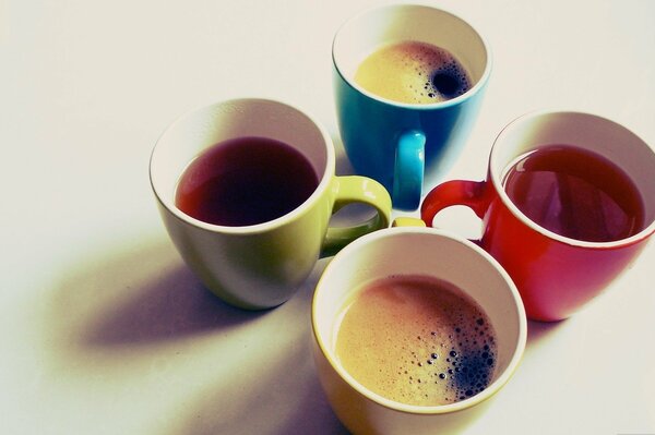 Bright-colored mugs with coffee