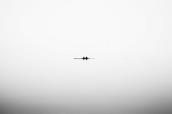 Minimalism the river is quiet and he is on a boat