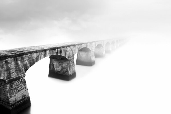 Bridge in the fog on the background