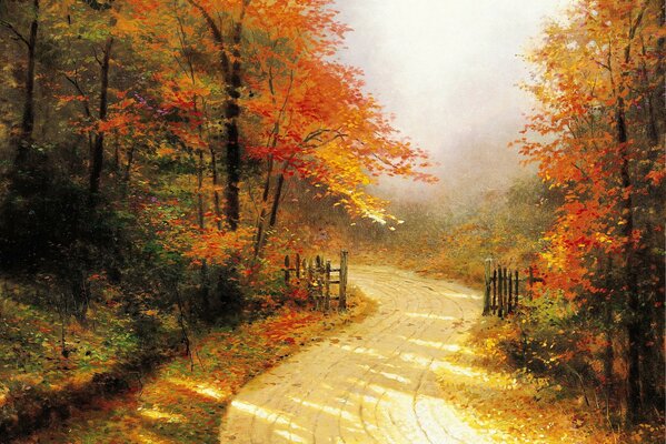 Autumn has painted the road and the forest in golden colors