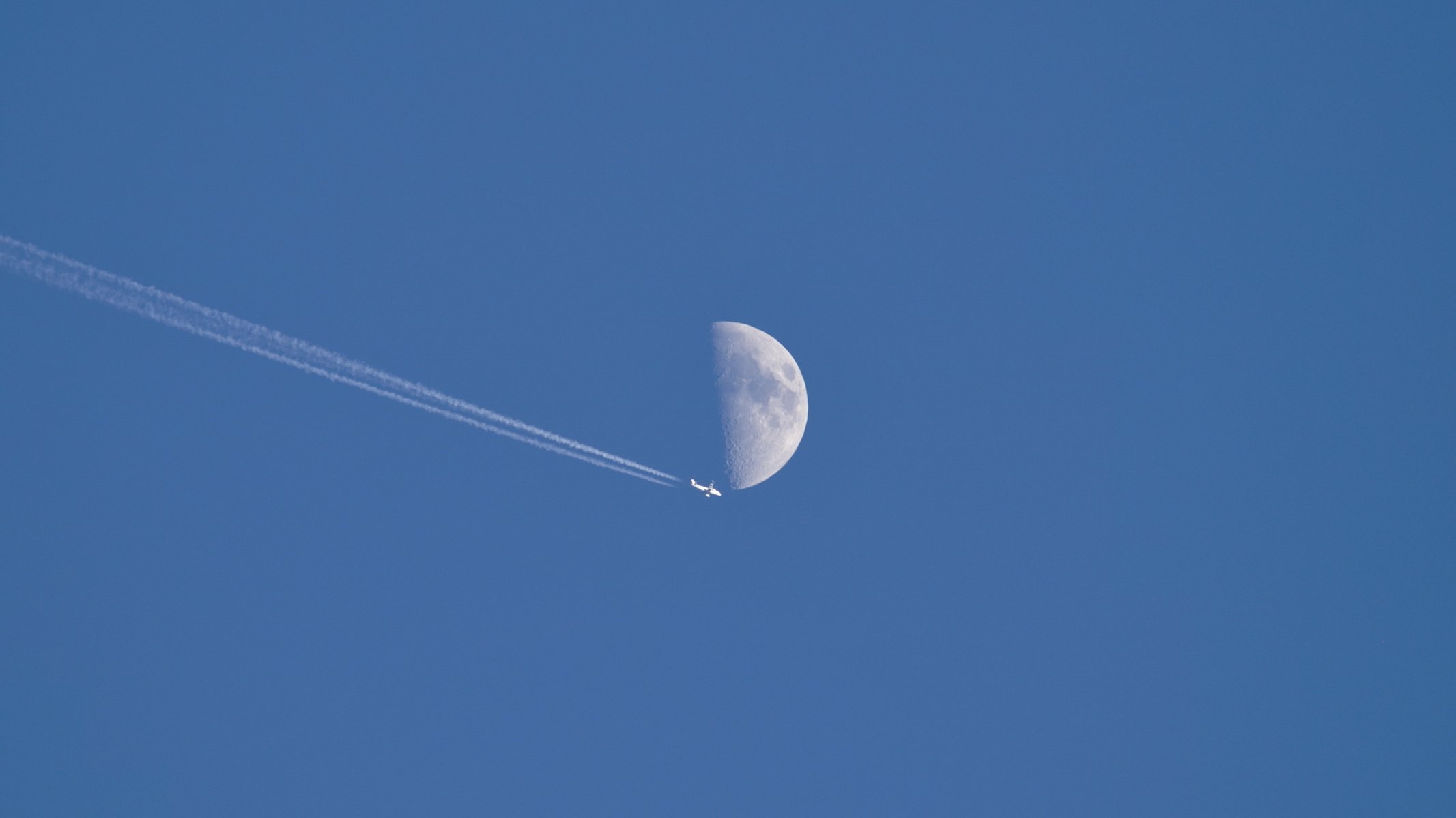 plane moon sky