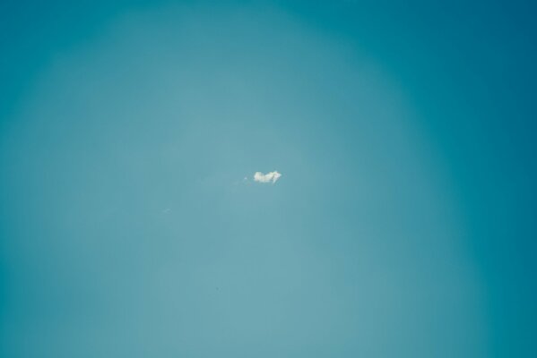 A cloud in the middle of a blue sky