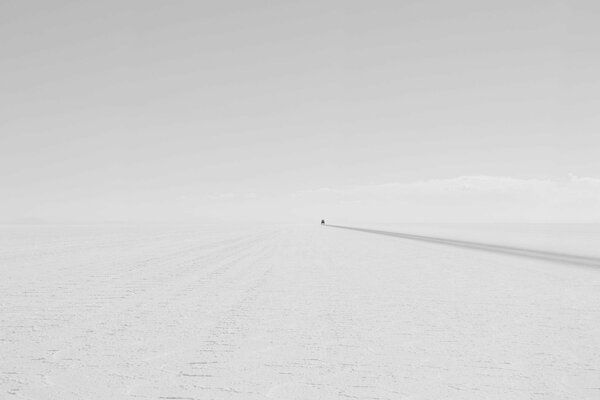 Car tracks on a snowy background