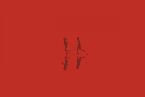 Reflections of silhouettes of running children on a red background