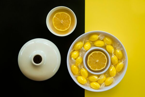 Tea with lemon on a black and yellow background