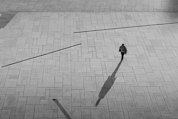 The shadow of a woman on the square