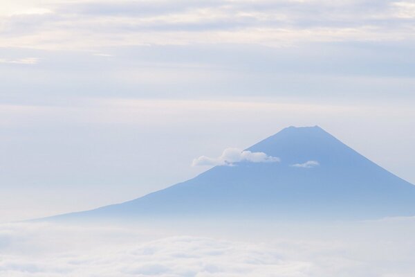 The soft blue sky and the top of the mountain