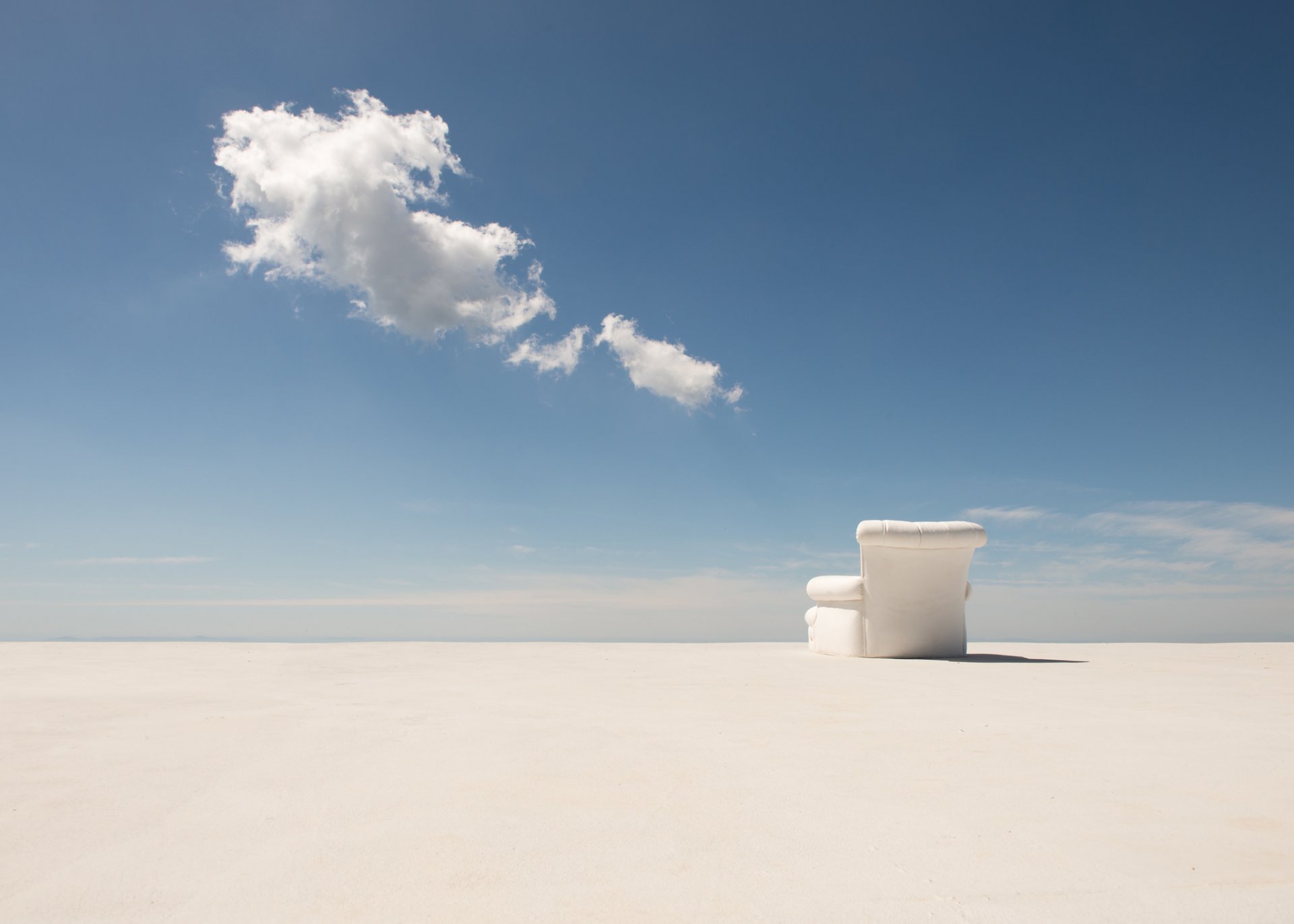 chair shadow desert horizon clouds sky