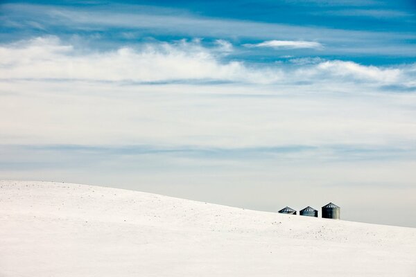 A field with snow, in view of the clouds