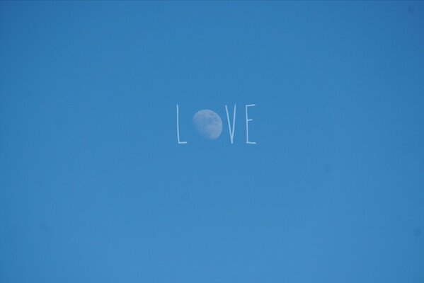 Minimalist Love inscription on the sky background