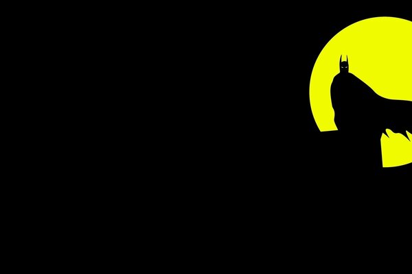 Silhouette de Batman sur fond de lune jaune