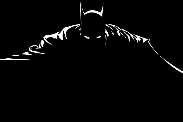 Batman s silhouette in a raincoat on a black background