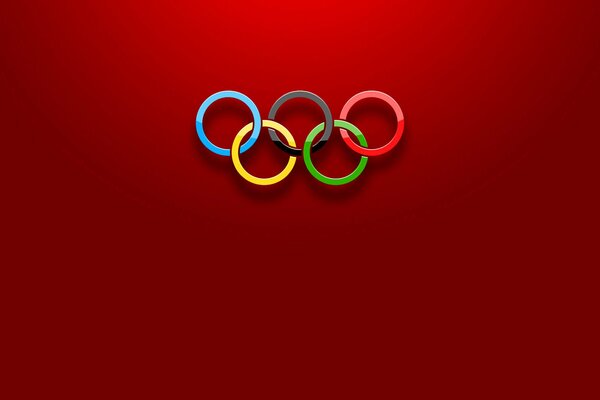 Olympische Ringe auf rotem Hintergrund