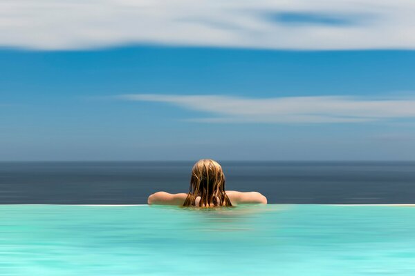 Girl with long hair in the water