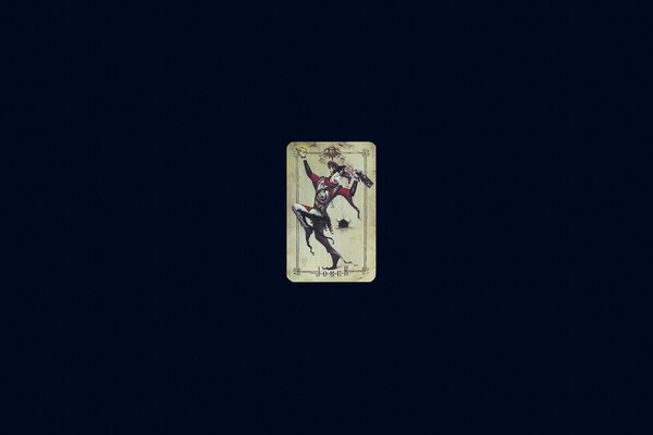 A card with a joker on a black background