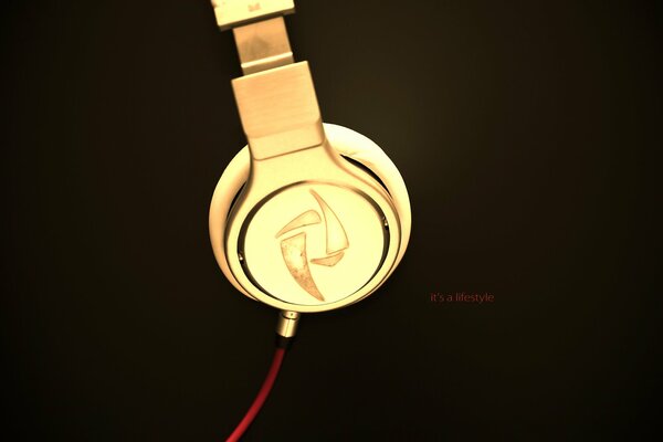 Gold headphones on a black background