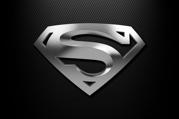 Insignia de Superman de plata sobre fondo negro