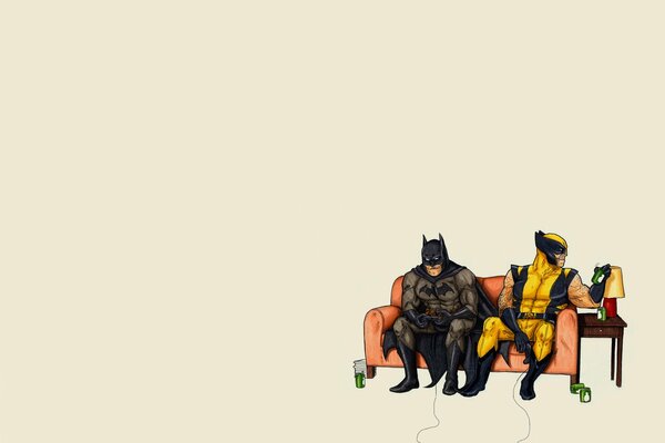 Batman und Wolverine spielen auf der Couch