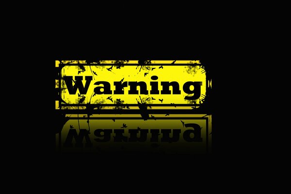 Danger warning on a black background in English