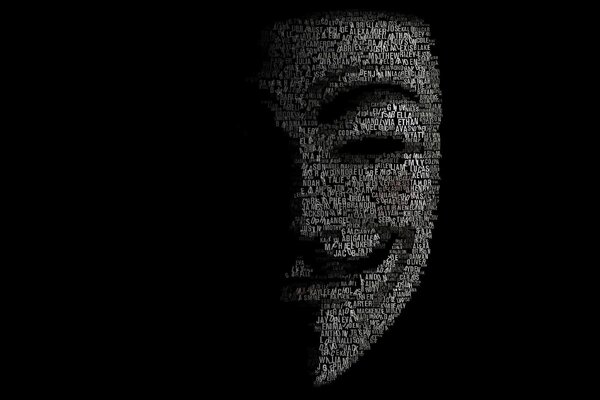 Half a mask of words on a black background