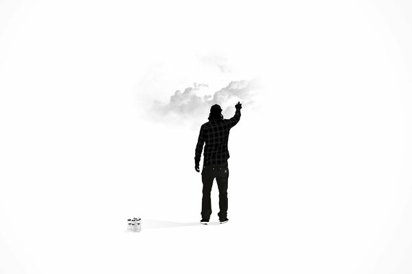 Image of a man with his hand outstretched into the clouds