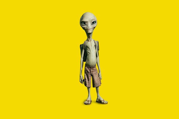 A confident alien on a yellow background