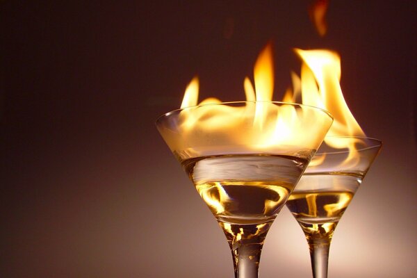 Two glasses with a fiery cocktail