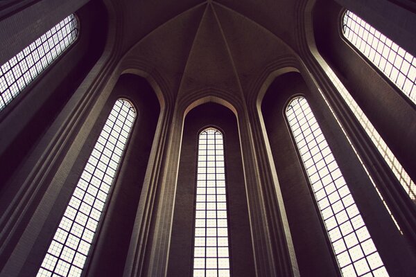 The building has a high ceiling and high windows