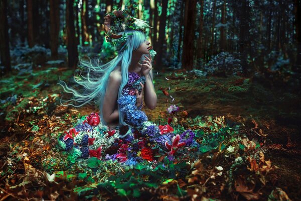 The forest maiden is sitting in the middle of the forest