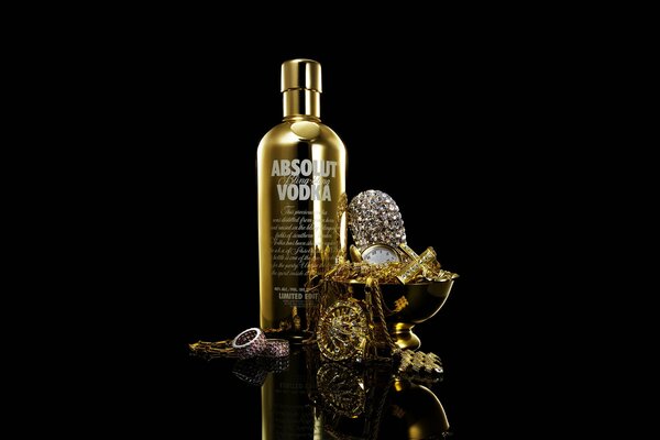 Absolut vodka with gold on a black background