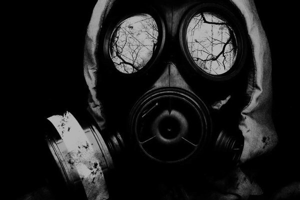 Black and white photo of a face in a gas mask