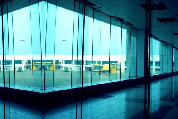 Glass corridor with windows overlooking the courtyard